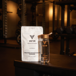 Verve Creatine Monohydrate Powder pouch and branded water bottle on a gym bench, with gym equipment in the background.