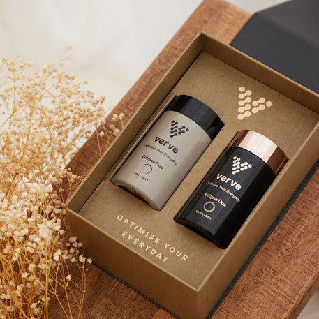 Close-up of the Verve Eclipse Duo sleep supplement gift box, featuring Twilight and Midnight capsules designed to support restful sleep, set on a wooden surface with dried flowers.