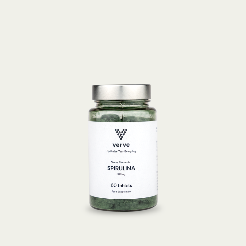 Clear glass bottle with silver lid containing green tablets, labelled "Verve Elements Spirulina 500mg, 60 tablets".