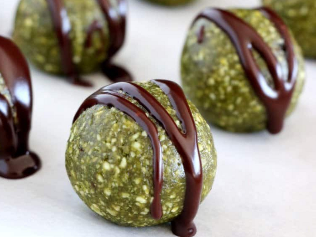 Green V80 energy balls drizzled with dark chocolate