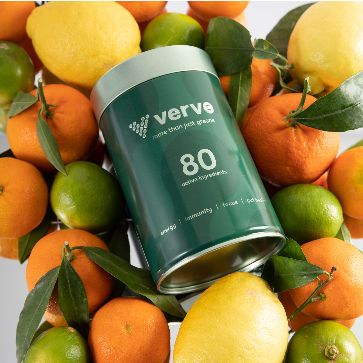 Verve Tin resting on oranges and lemons