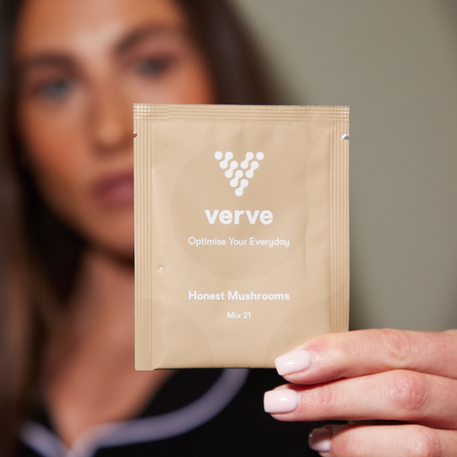 A woman holding a brown sachet labelled "verve" titled "Honest Mushrooms".