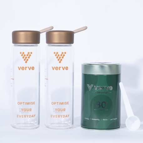 Two Verve glass bottles with bronze lids and straws, next to a green Verve container labelled “80 active ingredients” with a white scoop beside it.