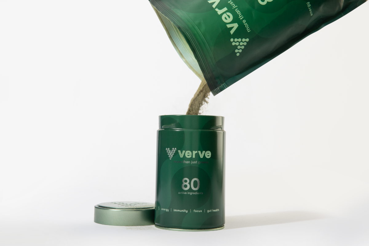 Verve greens powder being poured into Verve tin