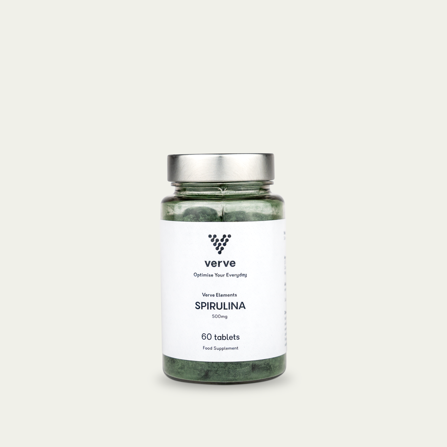 Clear glass bottle with silver lid containing green tablets, labelled "Verve Elements Spirulina 500mg, 60 tablets".